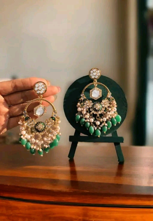 Green chandelier type earrings